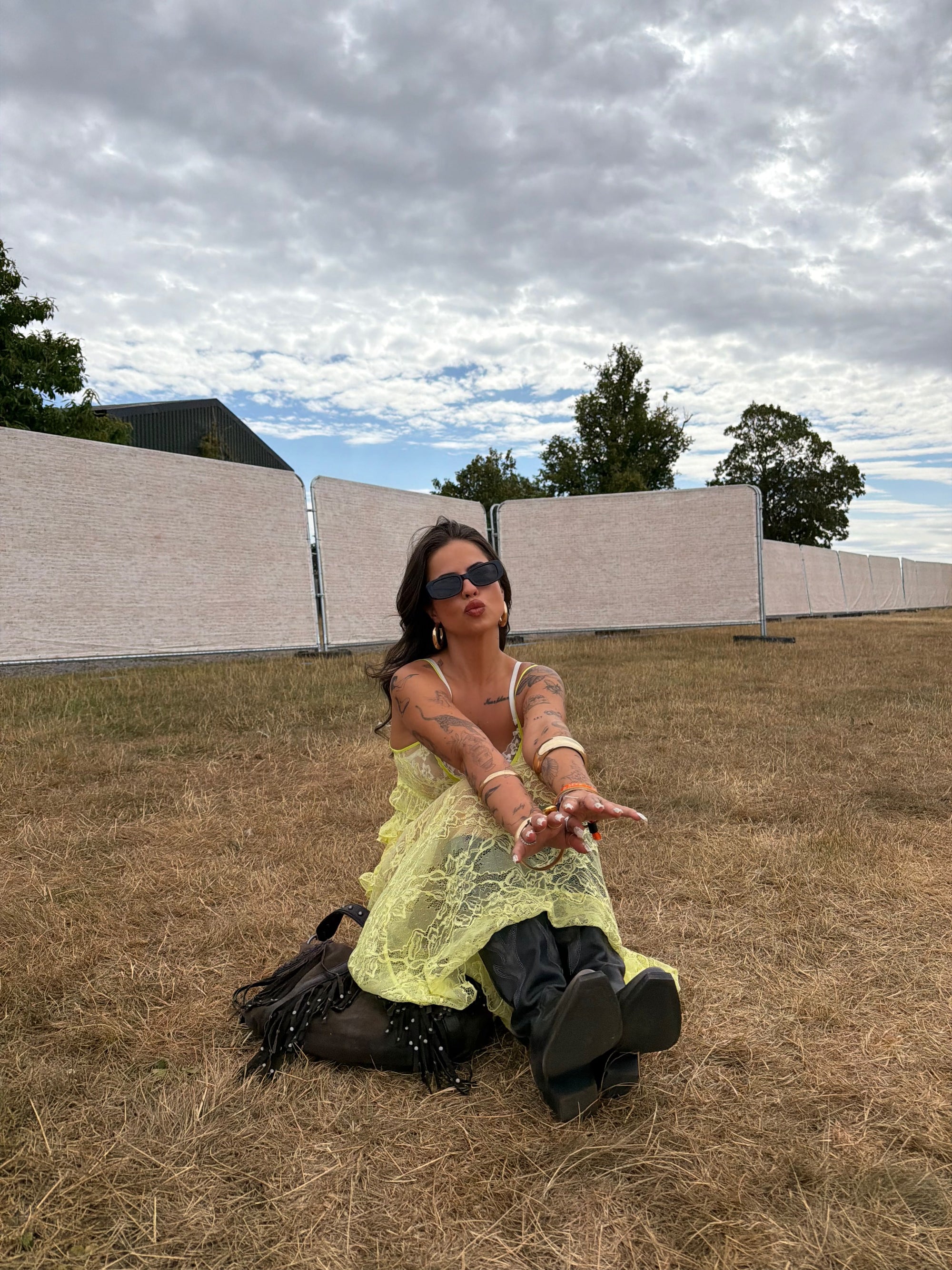 Wild Lovers Sunkiss lace dress styled with cowboy boots for a festival-inspired outfit.