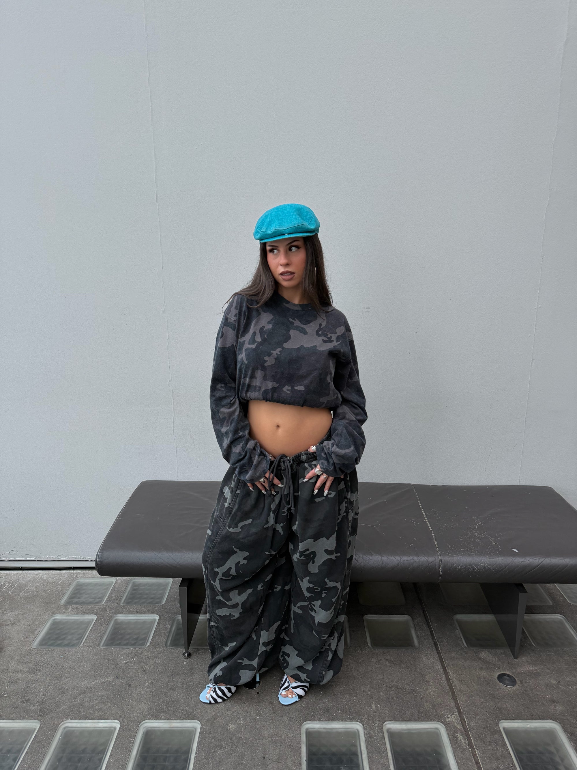 Matching Weekday camo long sleeve tee and oversized camo joggers.