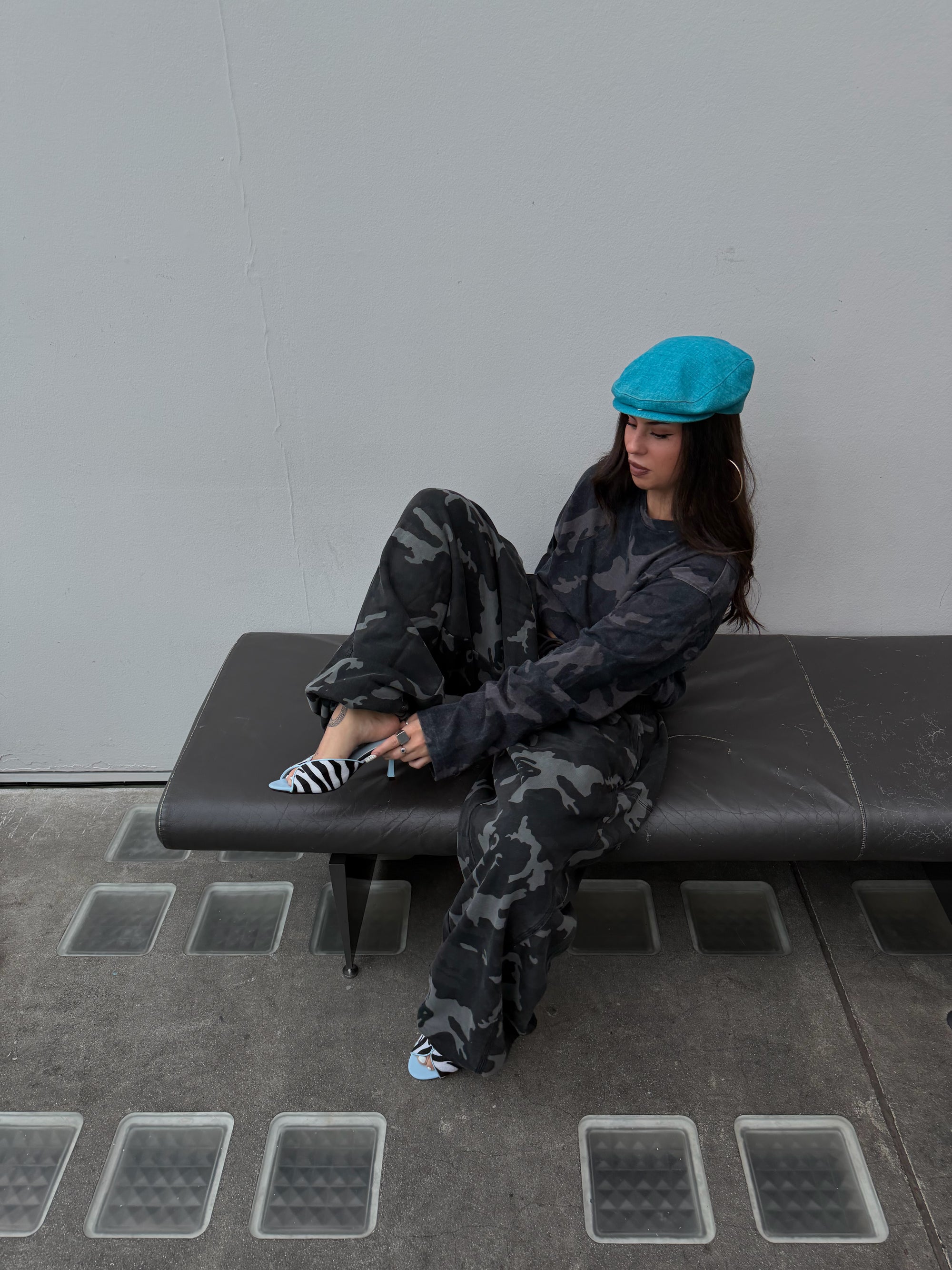 Matching Weekday camo long sleeve tee and oversized camo joggers.