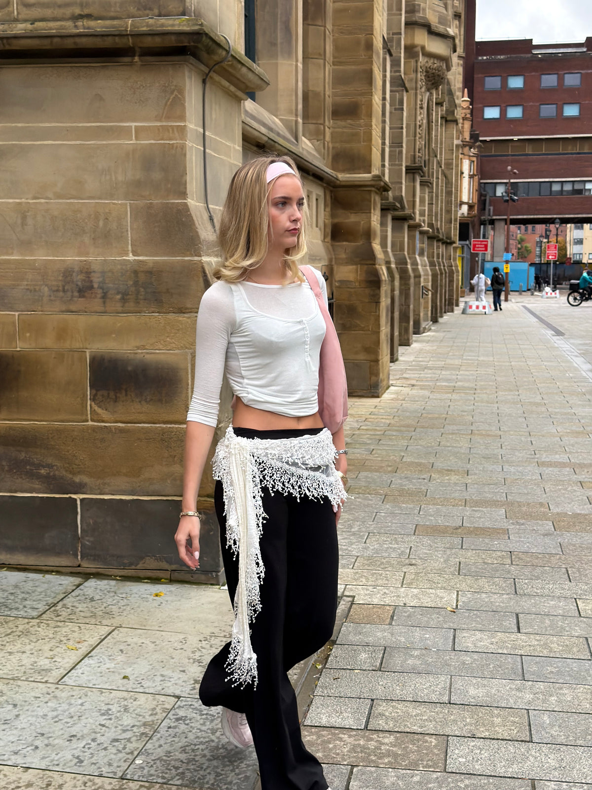 Black Weekday straight leg trousers styled with a white button-front henley top.