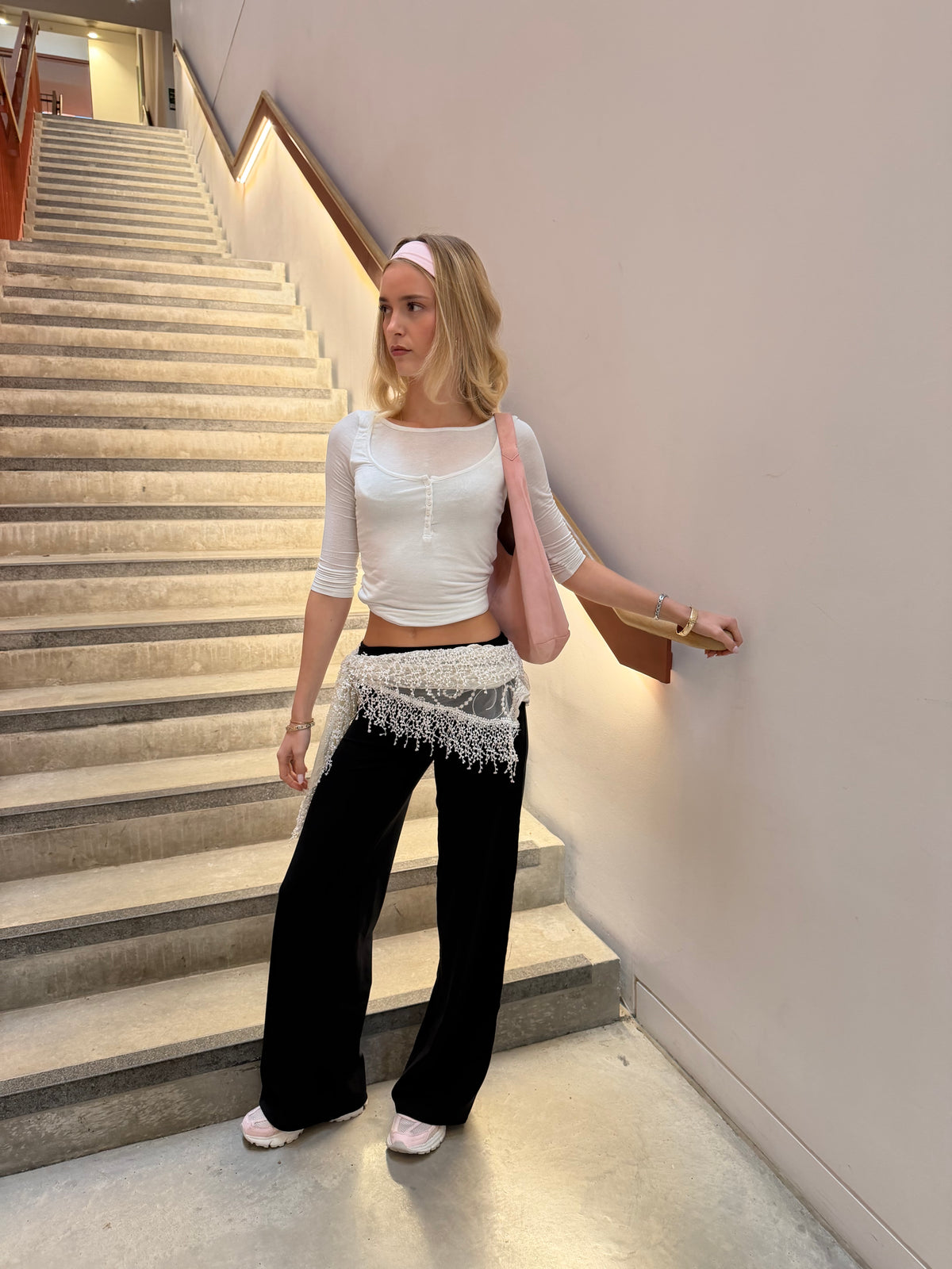 Black Weekday straight leg trousers styled with a white button-front henley top.