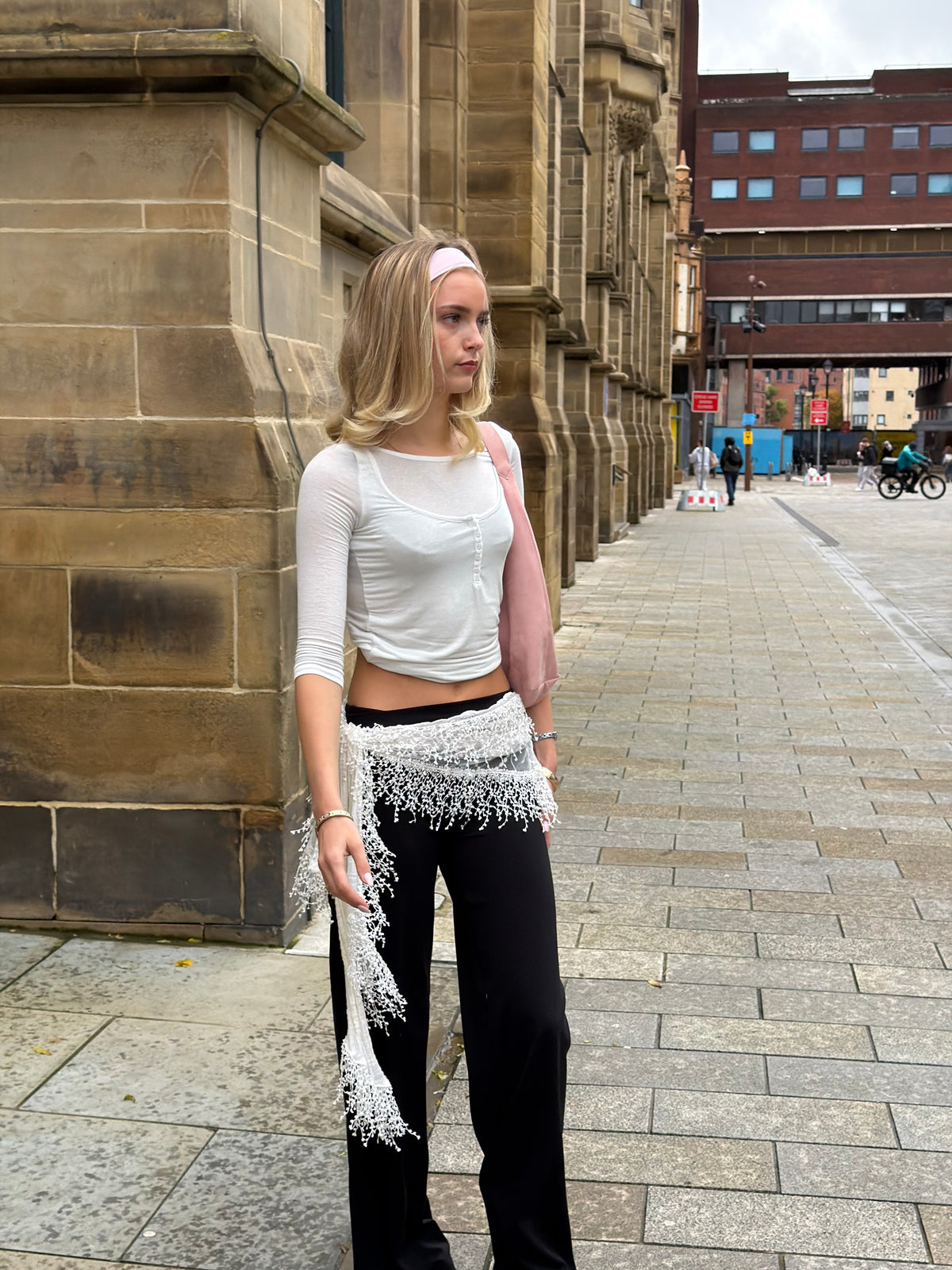 Black Weekday straight leg trousers styled with a white button-front henley top.