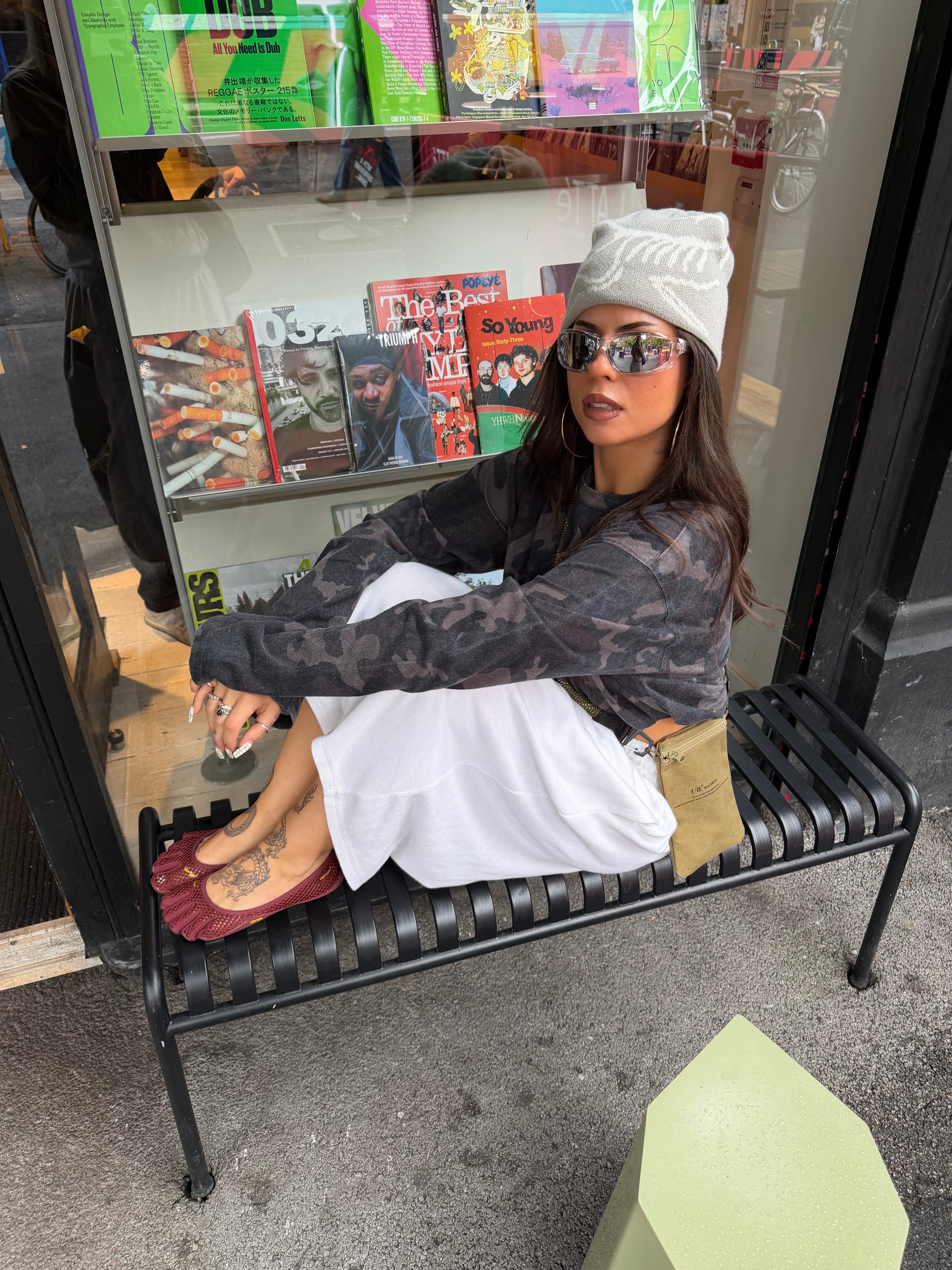 Weekday camo long sleeve top styled with oversized white jogger jorts.