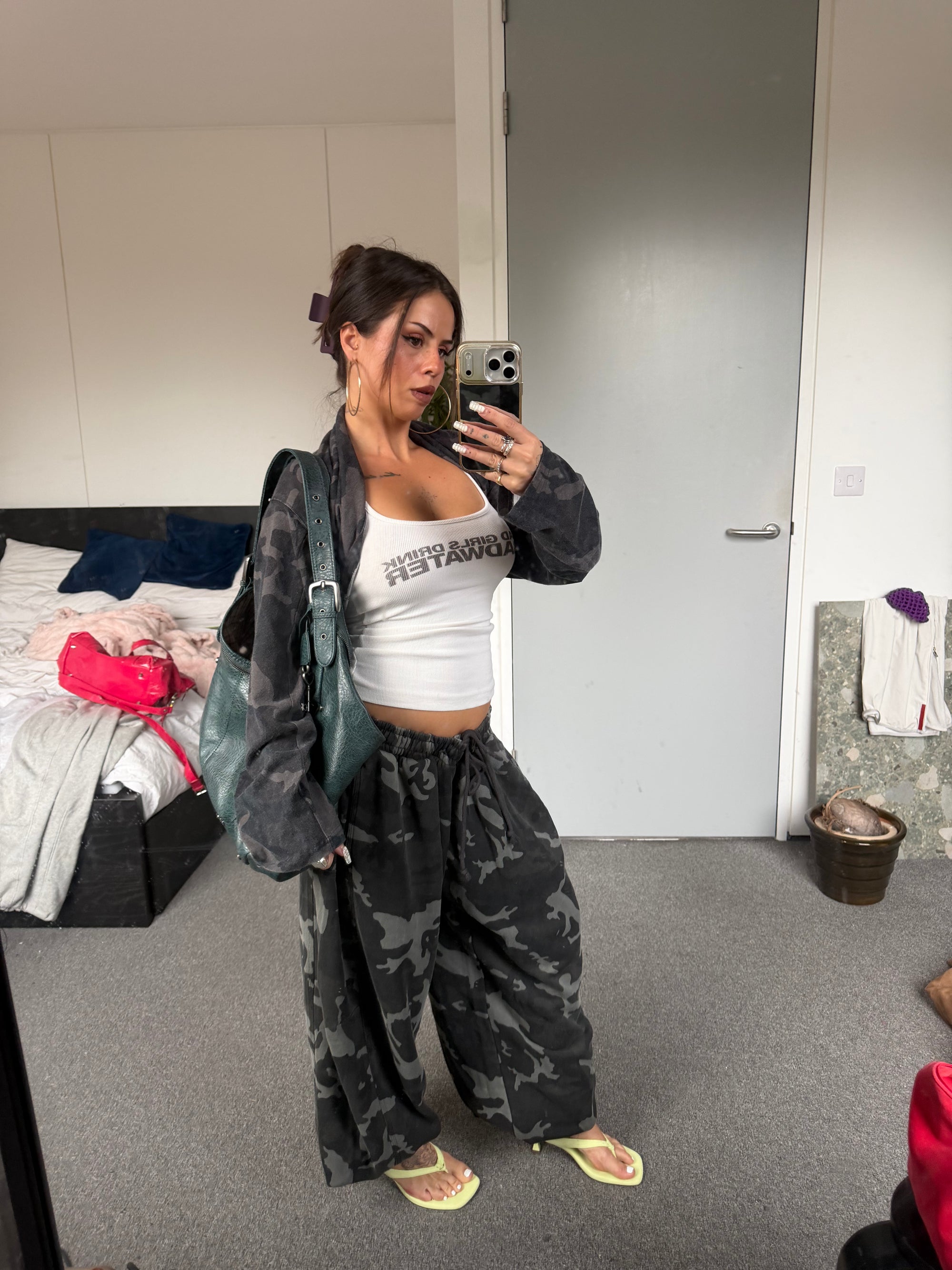 Weekday camo zip-up hoodie styled with matching camo joggers.