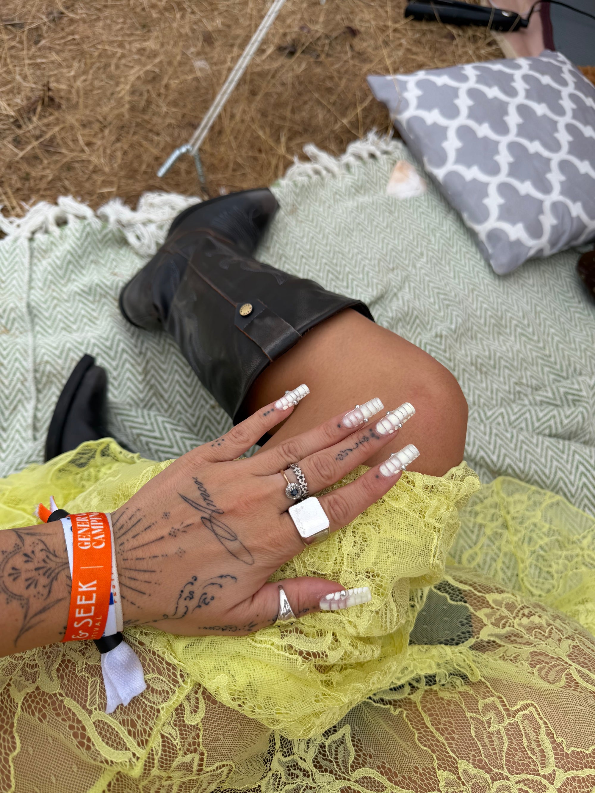 Wild Lovers Sunkiss lace dress styled with cowboy boots for a festival-inspired outfit.