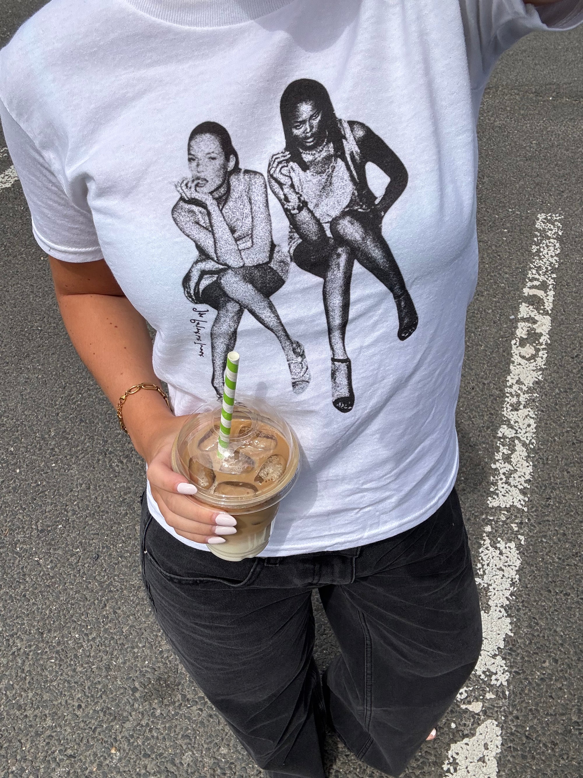 White In Print We Trust After Party Baby Tee styled with black Studio 54 jeans and a blue bag.